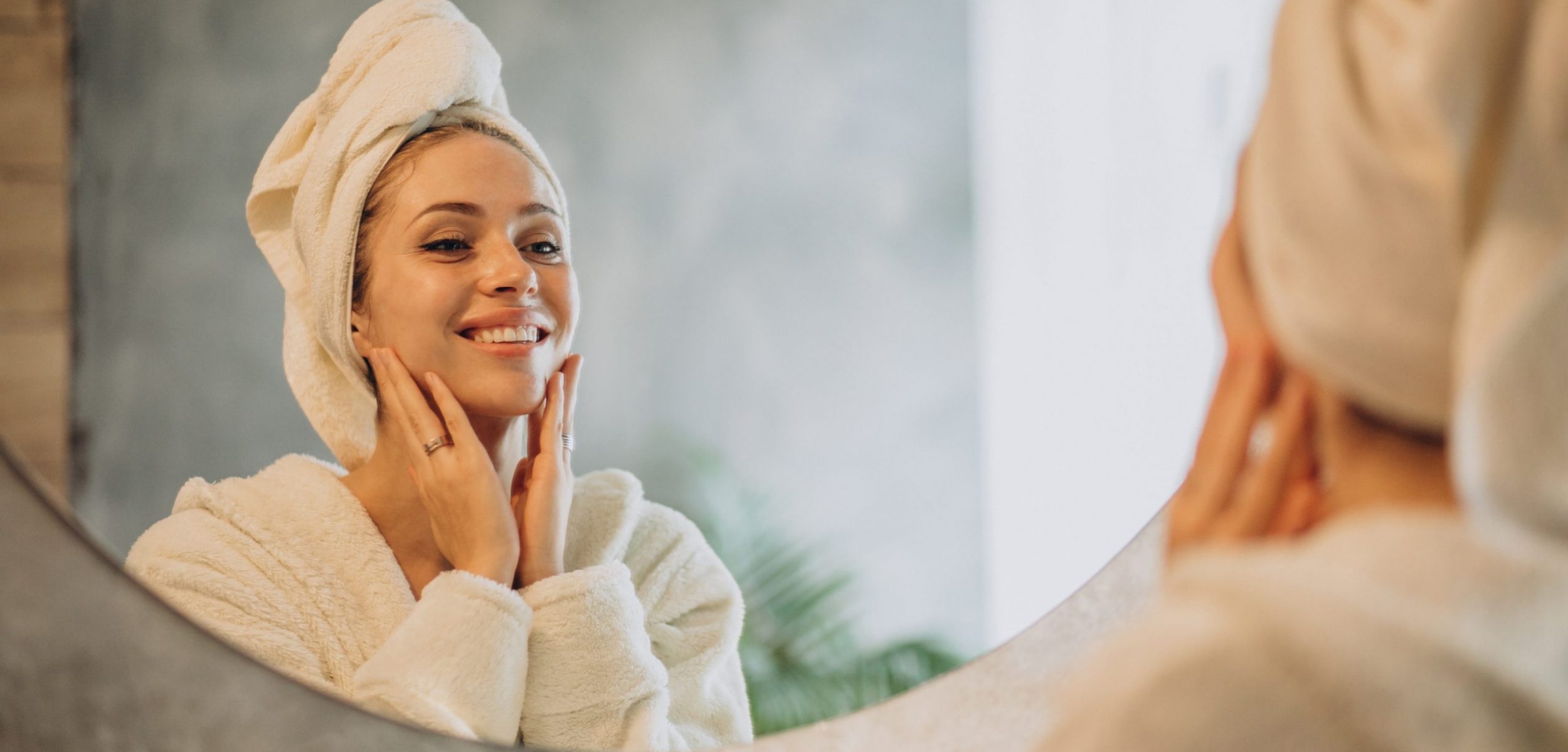 Woman at home applying cream mask